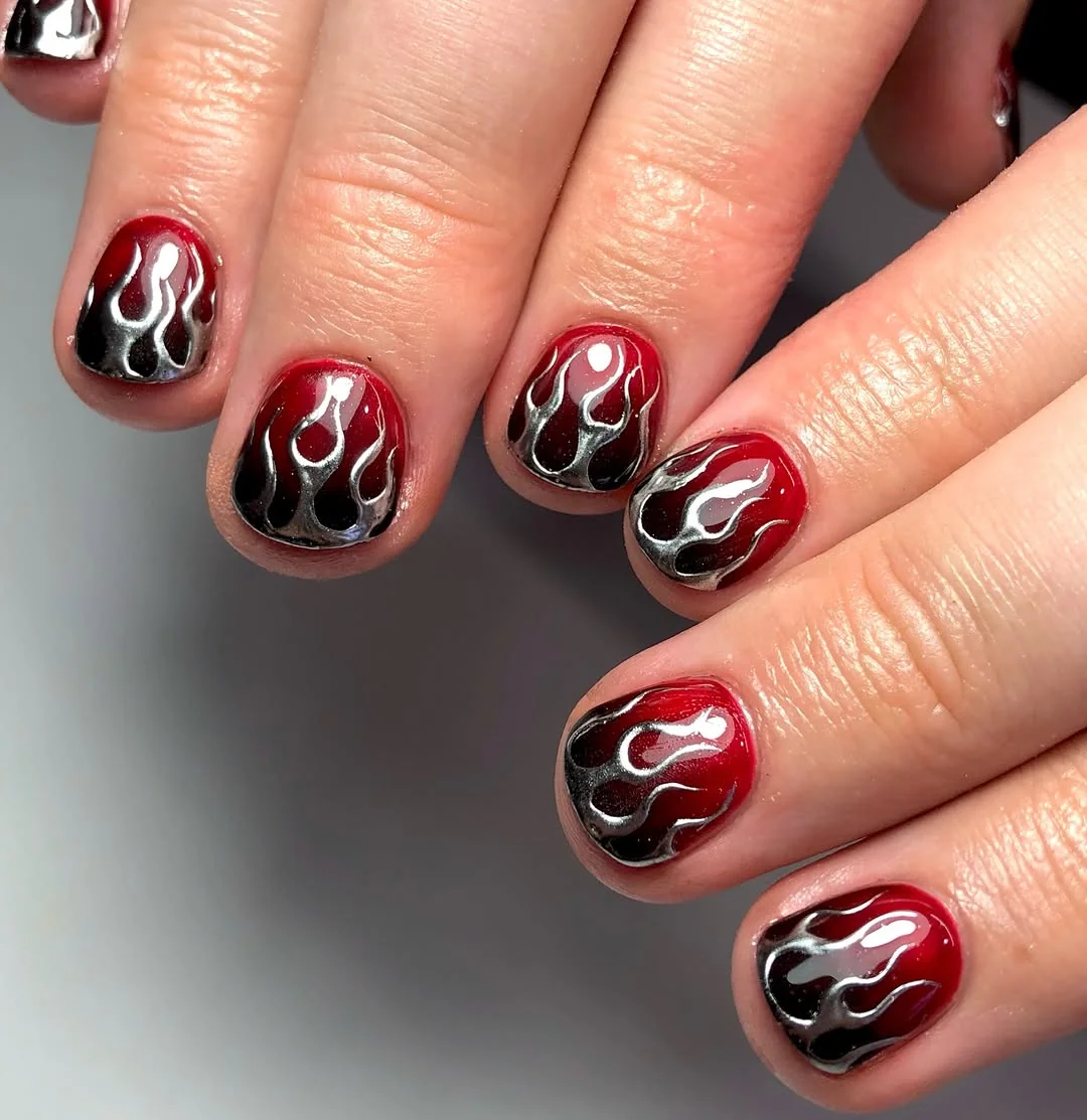 Short red men's nails with silver chrome flame art
