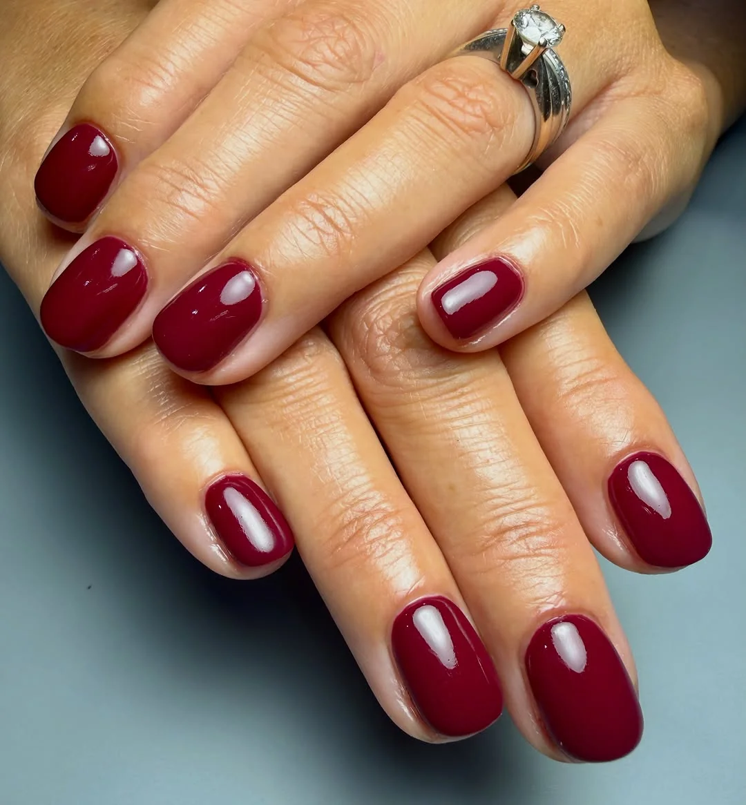 Short glossy burgundy squoval nails