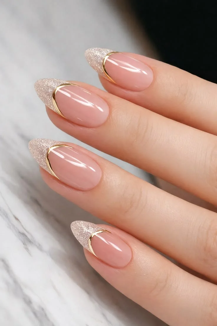 Sheer nude almond nails with gold outline French tips