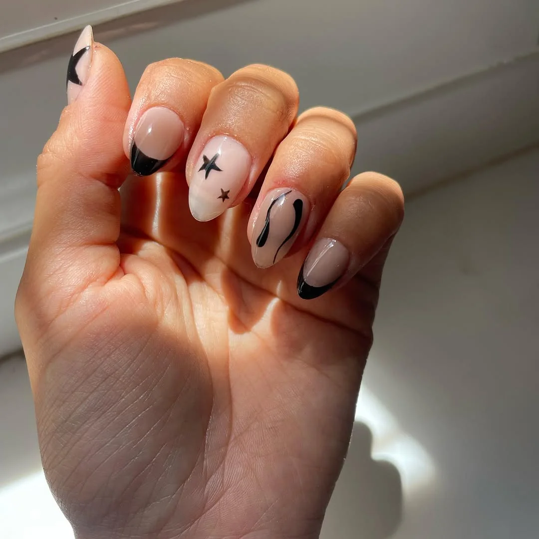 Black Accent Almond nail design idea