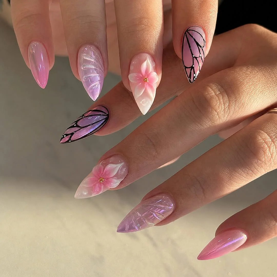 Pink and lavender stiletto nails with butterfly wings and 3D flowers