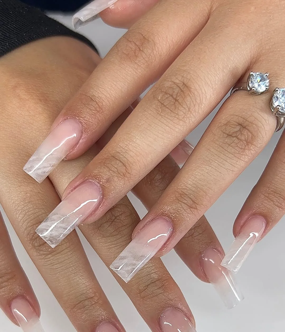 Clear marble ombré coffin nails fading to a milky white tip