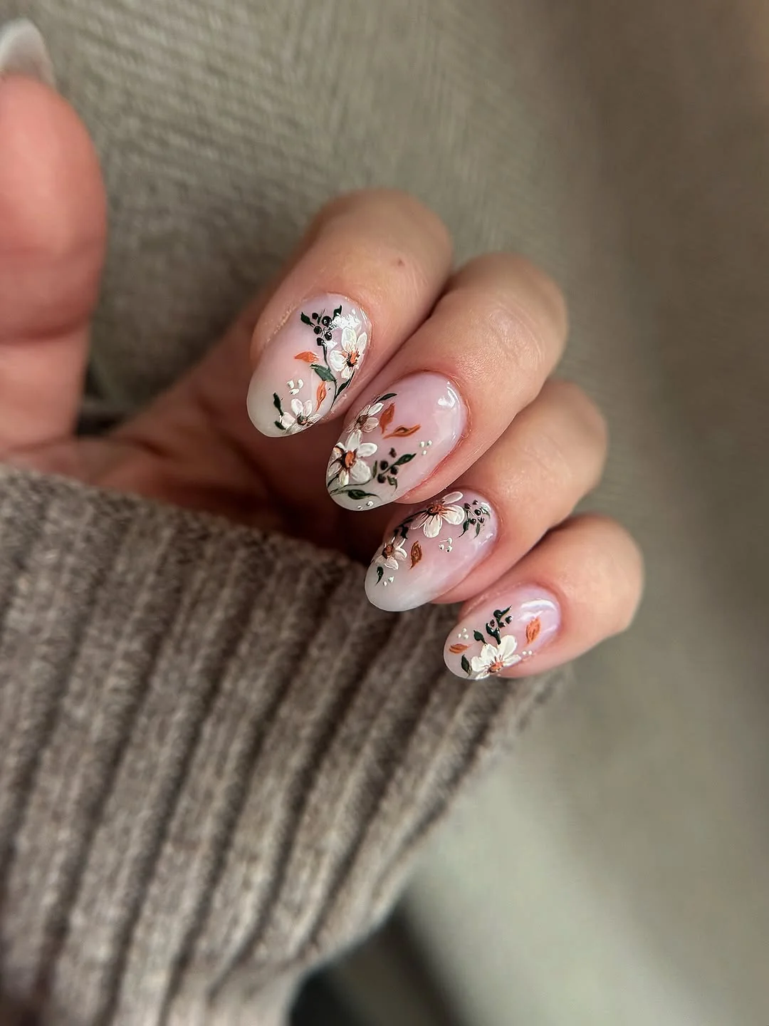 Short white nails with delicate winter floral art
