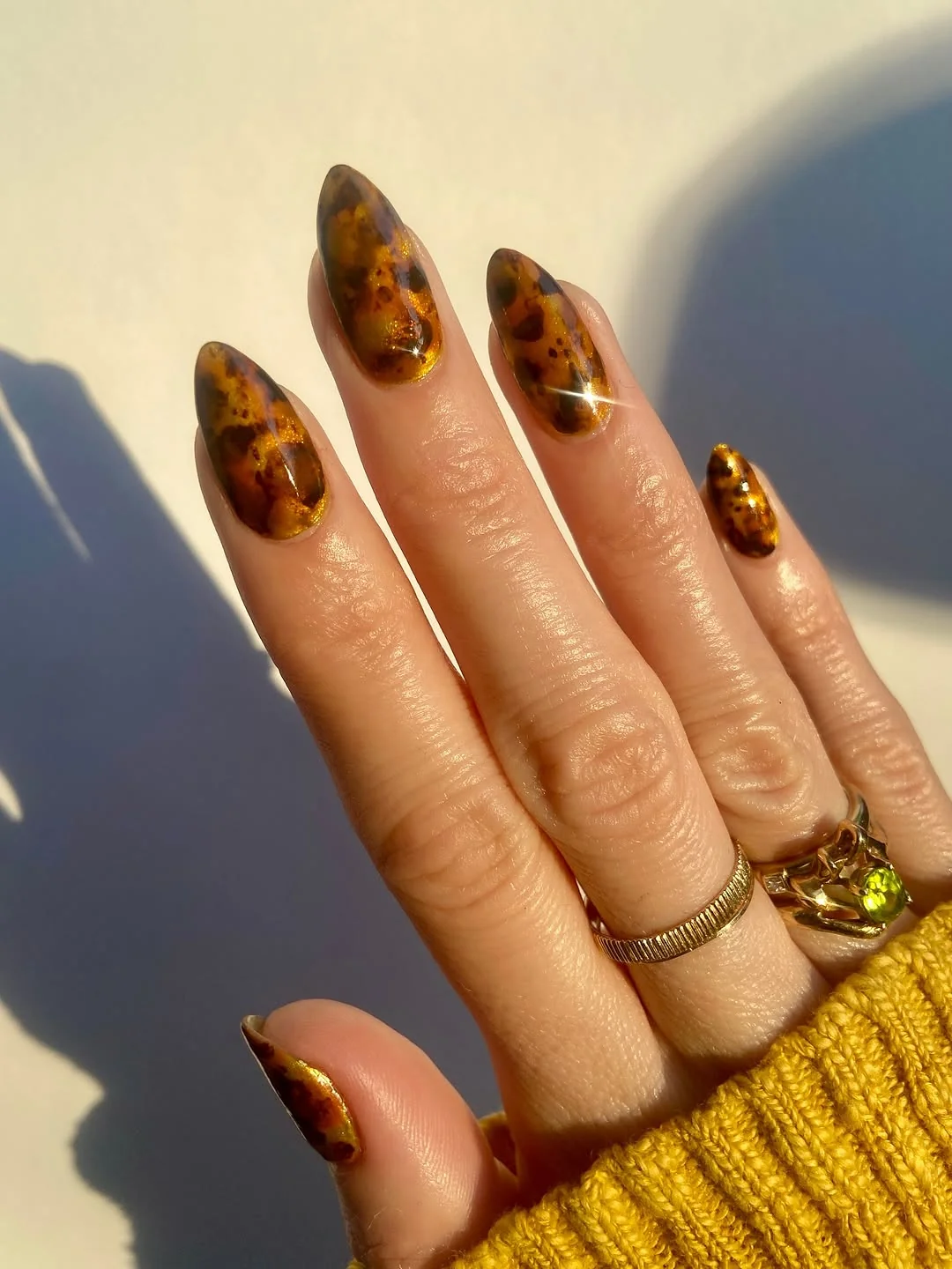 Almond nails with tortoiseshell tips and velvet-effect finish