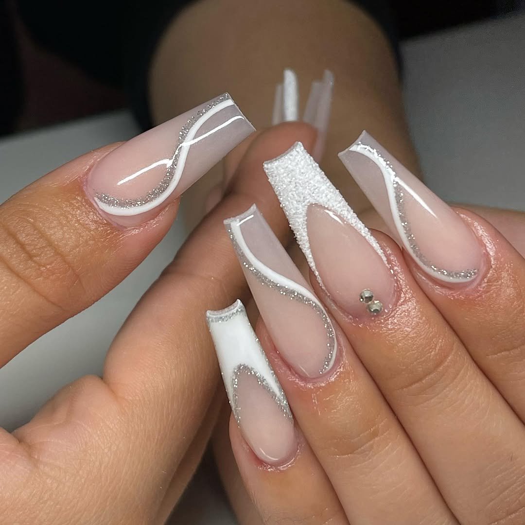 Long coffin nails with white swirl French lines and a little glitter