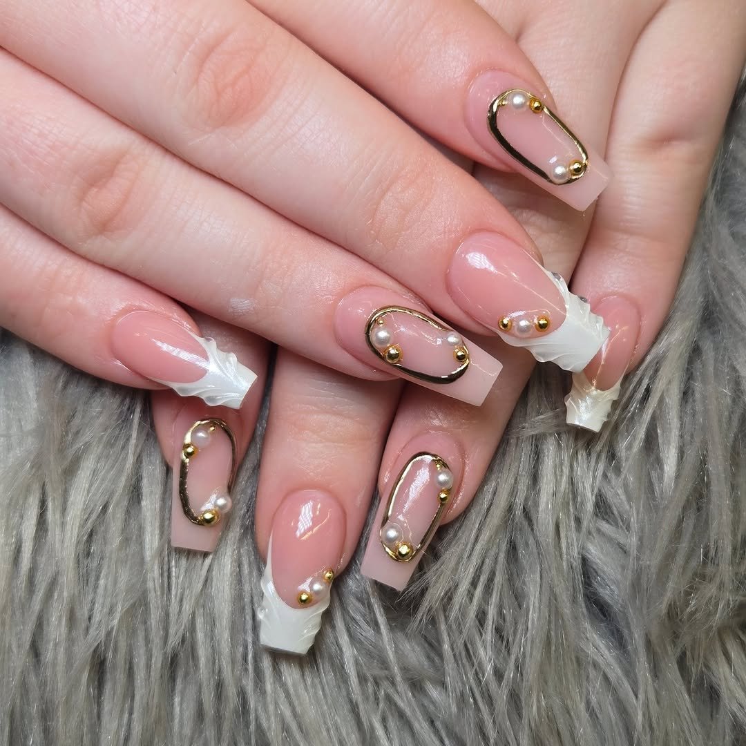 Nude French tip nails with thin gold line art