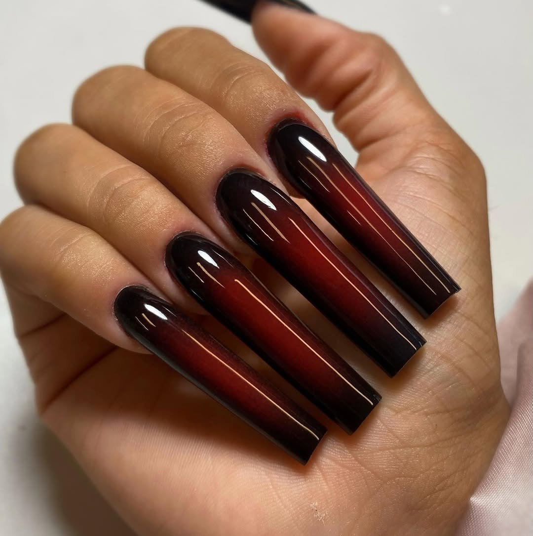 Long coffin nails with a cherry red to black gradient