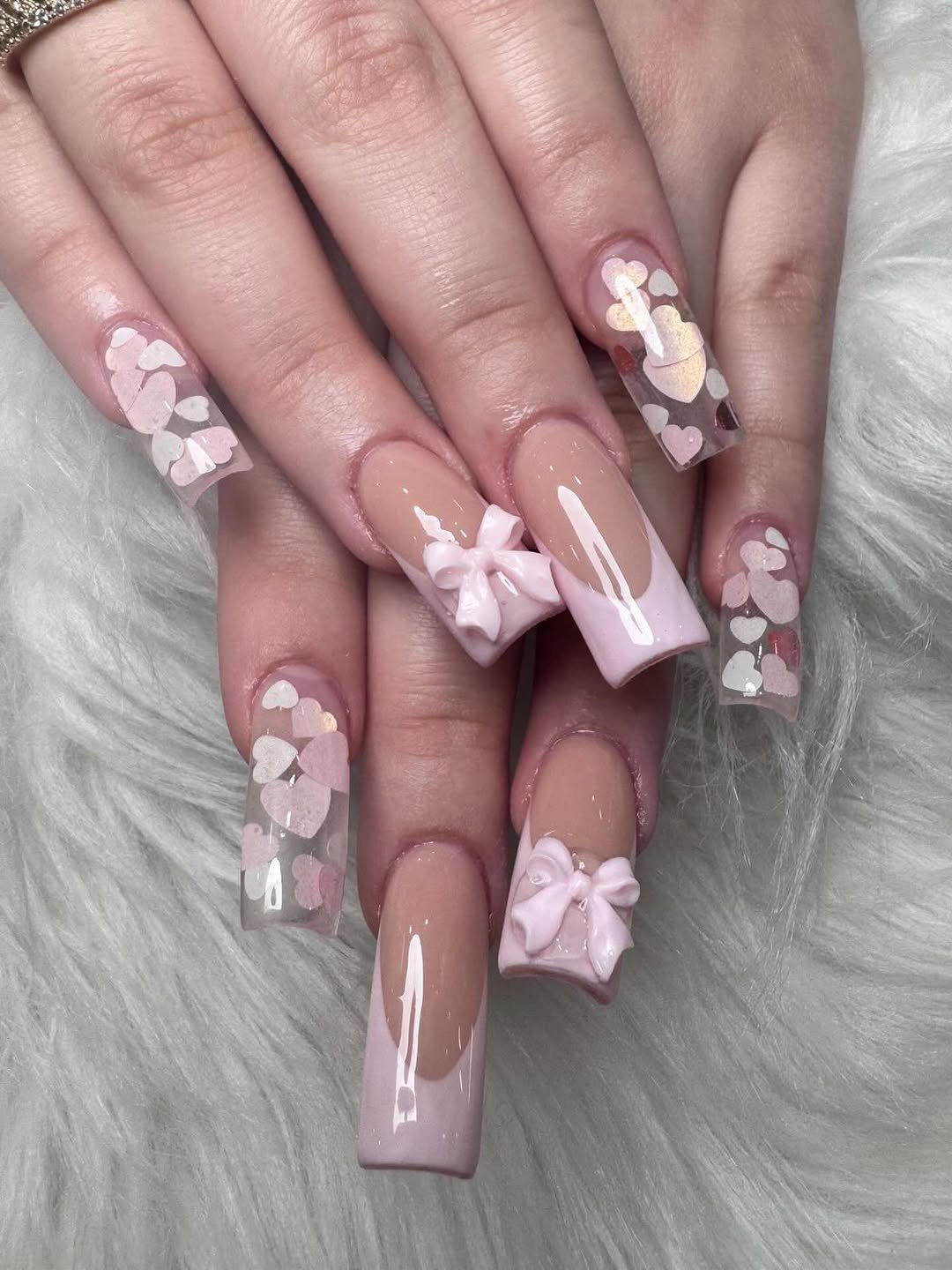 Pink nails with white 3D flowers and pink bows