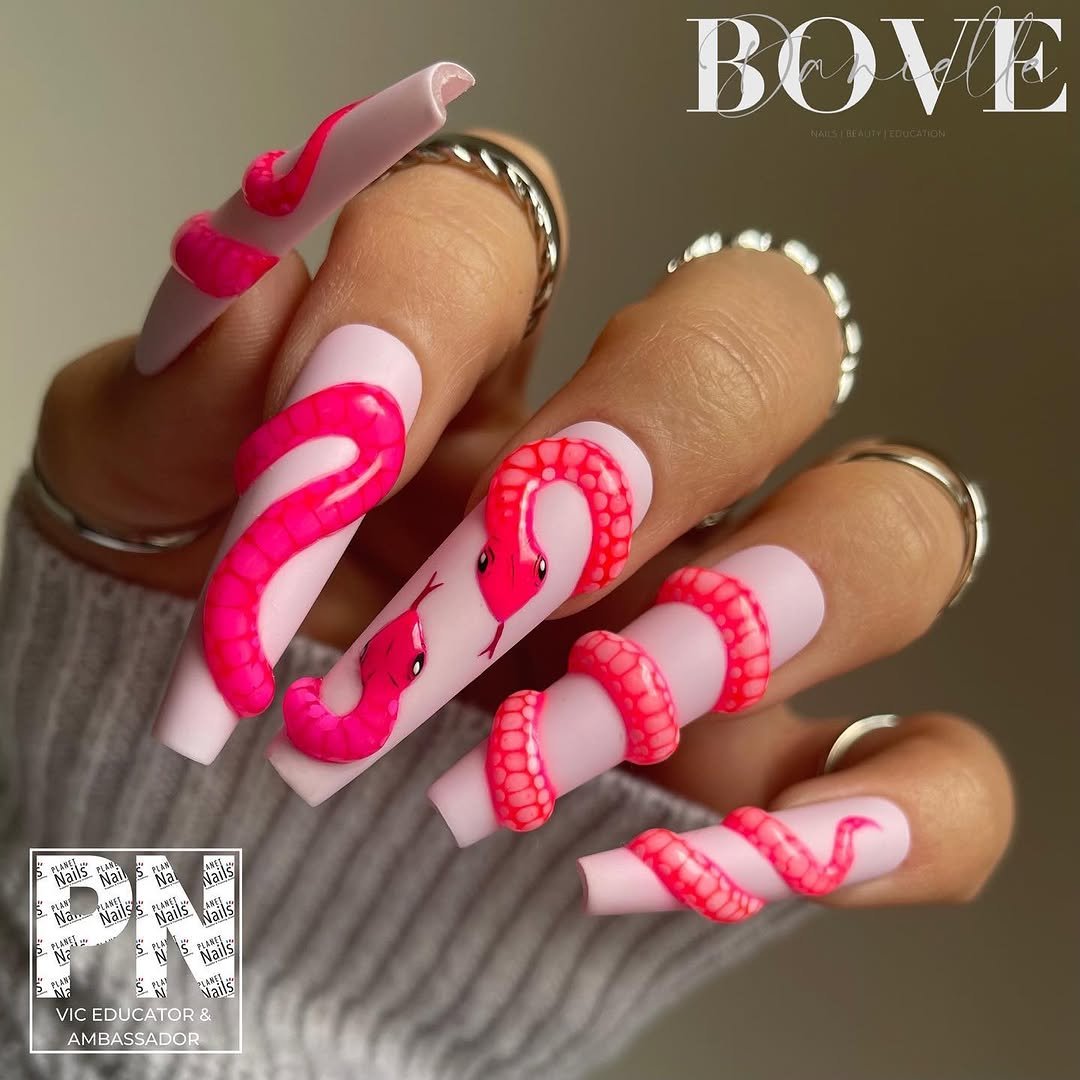 Matte white and pink nails with hot pink 3D snakes